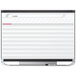 A white Quartet magnetic dry erase board with a red planner.