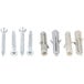 A group of screws and nuts on a white plastic object.