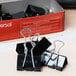 A box of Universal black medium binder clips.