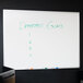 A Universal white melamine dry erase board with "department goals" written on it.