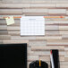 A brown cork bulletin bar on a white wall.