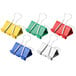 A group of Universal assorted color medium binder clips with metal clips in yellow, green, red, and white.