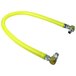 A yellow T&S Safe-T-Link gas hose with metal fittings on each end.