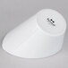 A Tuxton bright white china bowl on a white surface.
