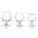 An Acopa Select clear brandy tasting snifter with a stem on a white background.