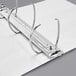 A white Avery durable view binder with silver metal rings.
