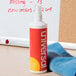 A white bottle of Universal dry erase cleaning spray with a red label.