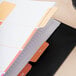A stack of paper with Avery Ready Index Table of Contents Dividers on top.