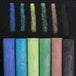 A row of Crayola drawing chalk in assorted colors.