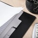 A file folder with Avery Write & Erase White Dividers and papers on a desk.