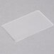 A white rectangular plastic card in a clear laminating pouch on a white surface.