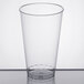 a clear glass with a black top