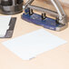 A white piece of paper with a blurry image of Avery Print-On White Tabs.