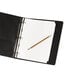 A black binder with Avery Write-On divider tabs and a pencil in it.