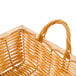 A rectangular wicker basket with handles.