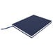 A dark blue Universal hardcover notebook with white edges.