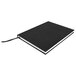 A black Universal casebound notebook with white edges.