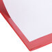 A red Universal economy non-stick binder with white paper inside.