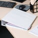 A white Universal economy non-stick view binder on a white surface.