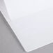 A white sheet of paper on a white surface.