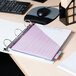 A white Universal economy non-stick view binder on a desk with a computer and printer.