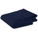 A folded navy blue Intedge square table cover.