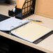 A Universal spiral bound 5 subject notebook on a desk.