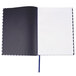 A dark blue Universal casebound notebook with a hexagon design and lined pages.