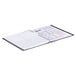 A spiral bound Rediform Daily Planner with a white cover.