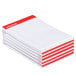 A stack of Universal narrow ruled white writing pads with red and white packaging.