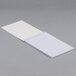 A Universal 6-Pack of white spiral bound Gregg rule steno notebooks.