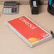 A Universal Wirebound Message Book on a desk.