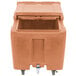 A brown plastic Cambro mobile ice bin with a sliding lid.