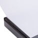 A close-up of a black Universal Deluxe Non-Stick View Binder with white lettering on the cover.