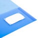 An Avery translucent blue folder with a white rectangular label.