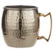 An American Metalcraft hammered gold metal mug with a handle.