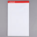 A Universal legal writing pad with white paper and red lines.