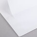 A white Universal Economy Non-Stick View Binder with a white sheet of paper inside.