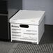 A close-up of a Universal white corrugated storage box with black text on it.