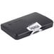 A black rectangular plastic box with a white label on a black felt stamp pad.