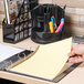 A hand holding a yellow Universal insertable divider tab.