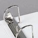 A Universal white economy view binder with metal slant rings and a metal clip.