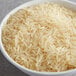 A bowl of Royal Chef's Secret Sella Parboiled Basmati rice on a table.