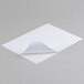 A white piece of paper with a curled corner.