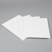 A stack of Universal white paper pocket folders.