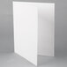 A white rectangular Universal embossed paper pocket folder with 2 pockets.