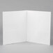 A white Universal letter size pocket folder with embossed paper.