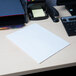 A white Universal letter size paper folder on a table.