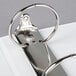A close-up of a Universal white ring binder with metal rings.