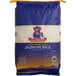 A blue and white bag of Royal Jasmine white rice.